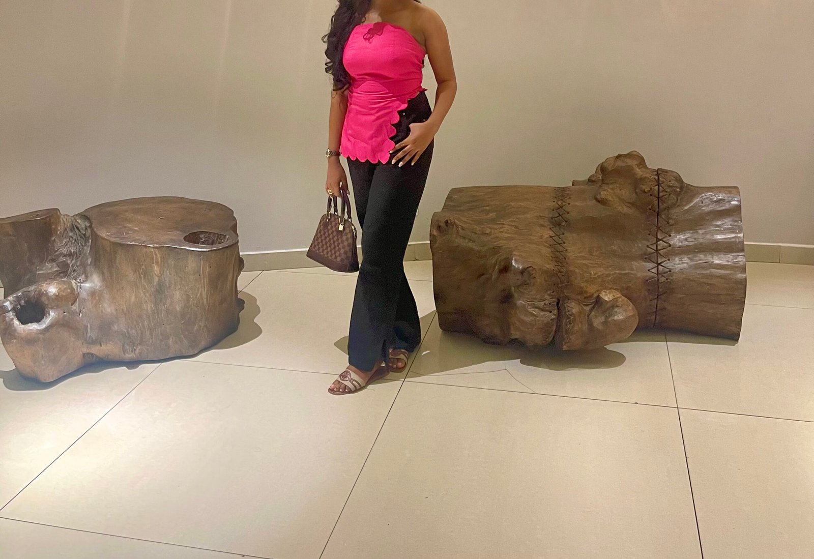 A model wears a pink Asymmetric Top